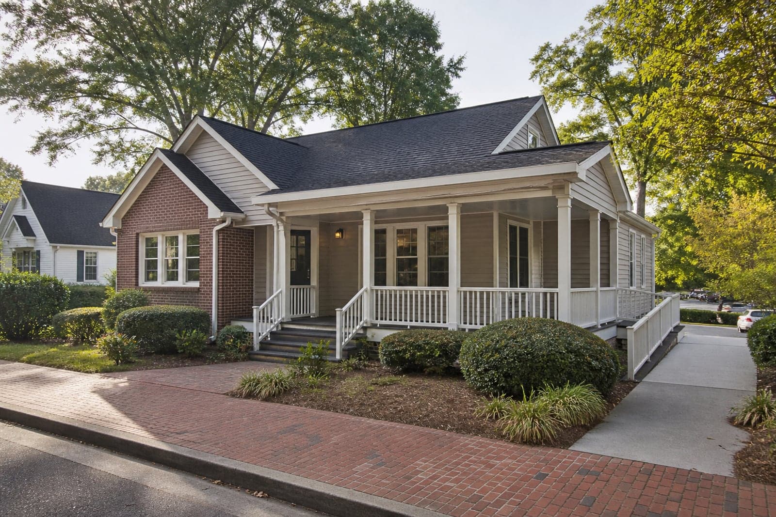 Converted Columbia office bungalow with porch, brick walkway, and mature shade trees.